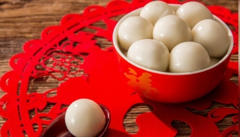 boiled balls of glutinous rice flour, eaten during the Lantern festival